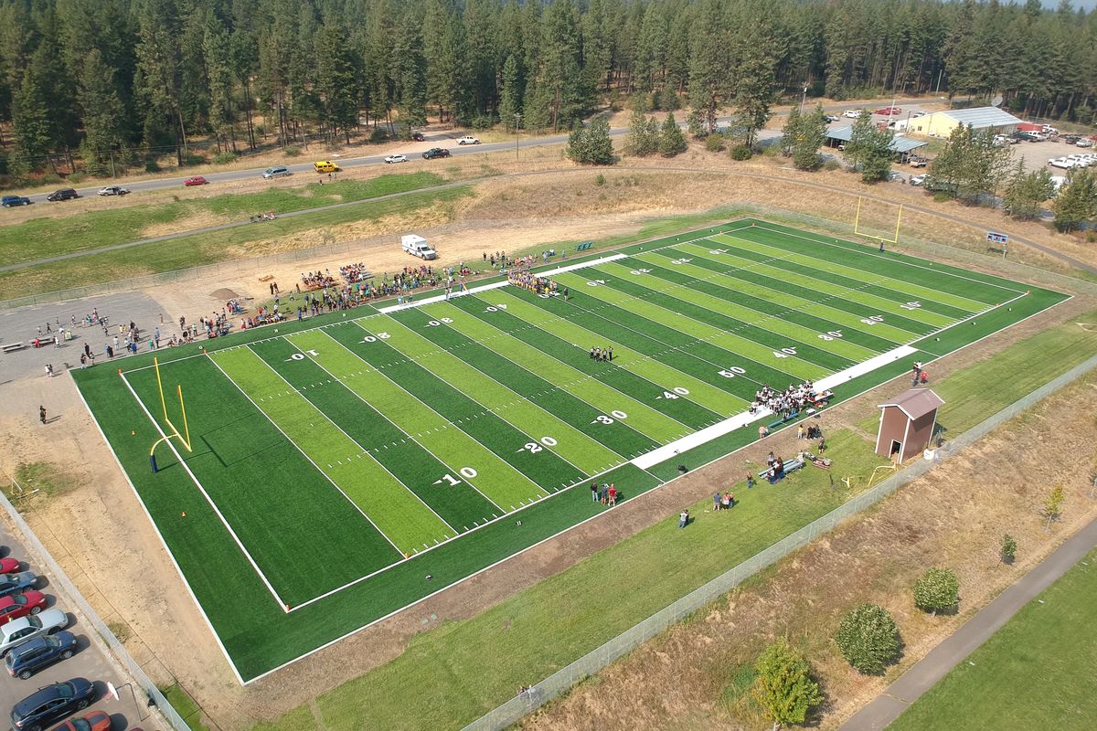 The permanently green football field at Wellpinit High School is courtesy of a grant from the National Football League, shown Friday, Sept. 9, 2022. The artificial turf makes Wellpinit the envy of tiny schools dotting Eastern Washington, where virtually every field is brown and dead by September.  Wellpinit hosted the first game on the field Friday.  (Jesse Tinsley/THE SPOKESMAN REVIEW)
