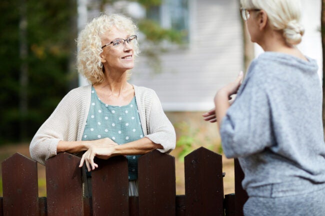 whose problem is it anyway women neighbors talking over picket fence