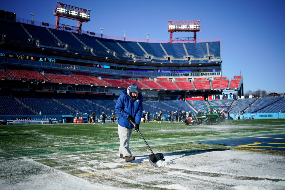 Dec 24, 2022;  Nashville, Tennessee, USA;  Ground crews clear snow from the field before the Tennessee Titans take on the Houston Texans at Nissan Stadium.  Mandatory Credit: Andrew Nelles-USA TODAY Sports